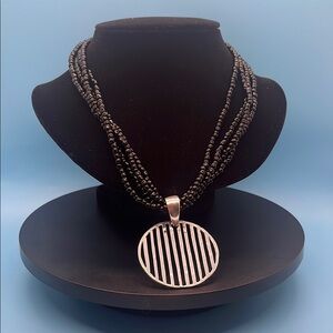 #0044.   Elegant Black Beaded Necklace with Silver Pendant